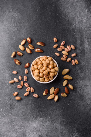 Whole peeled hazelnuts, roasted or raw, as an ingredient for healthy food. Hazelnuts as a background...