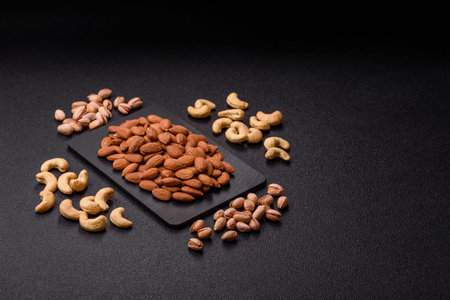 Raw and peeled almonds as a healthy food ingredient. Almonds as a food background for your designの写真素材