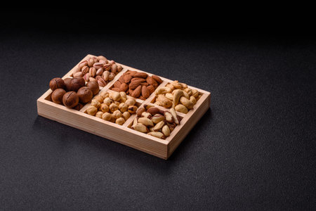 A mix of cashews, pistachios, almonds, brazil nuts, macadamia and hazelnuts as healthy food...