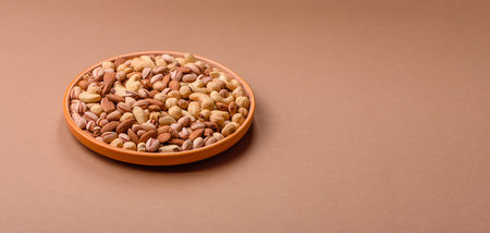 A mix of cashews, pistachios, almonds, brazil nuts, macadamia and hazelnuts as healthy food...