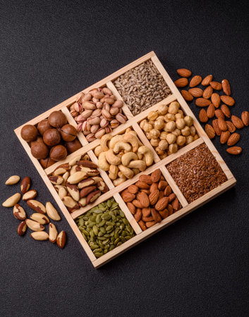 A mix of cashews, pistachios, almonds, brazil nuts, macadamia and hazelnuts as healthy food...