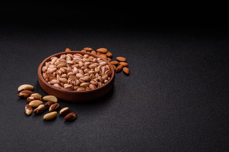 Salted pistachios in shells as a healthy, high calorie food ingredient. Pistachios as a food background for your designの写真素材