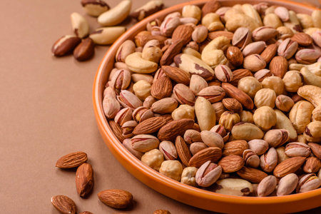A mix of cashews, pistachios, almonds, brazil nuts, macadamia and hazelnuts as healthy food...