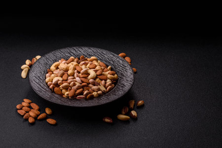 A mix of cashews, pistachios, almonds, brazil nuts, macadamia and hazelnuts as healthy food...