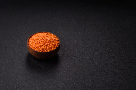 Raw red lentils as a source of protein for a healthy vegan meal. Red lentils as a food background...