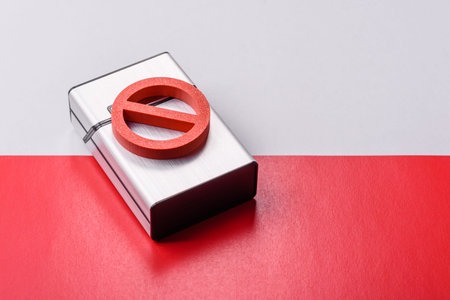 A metal cigarette box with a no smoking sign depicts a harmful habit, nicotine use, and the risk of...