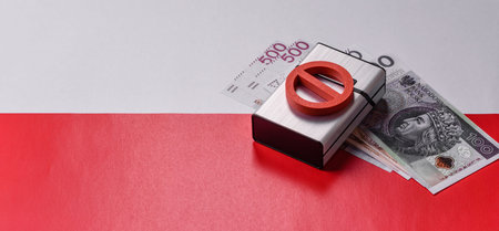 A metal cigarette box with a no smoking sign depicts a harmful habit, nicotine use, and the risk of cancer. A cigarette box and no smoking sign as a backdrop for your design.の写真素材