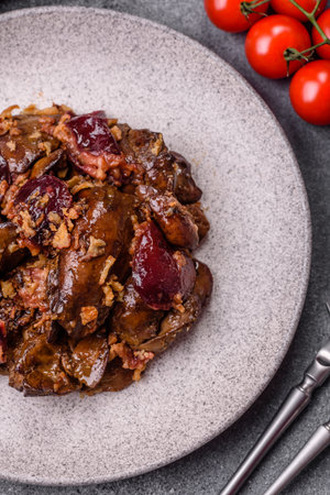 Chicken, duck, or goose liver with plums, onions, and spices. Chicken liver as a food background for your designの写真素材