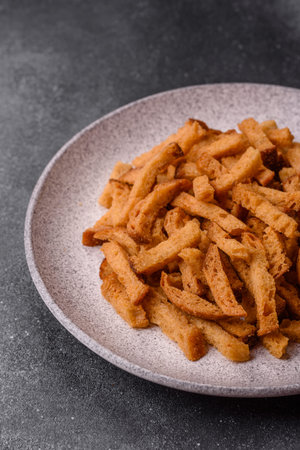 Croutons or crackers made from rye bread with garlic, salt, and spices, a salad ingredient. Croutons...