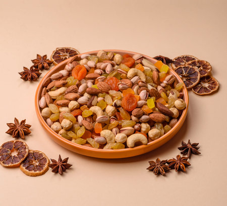 A mix of nuts and dried fruits as ingredients for a healthy meal. Nuts and dried fruits as a food...