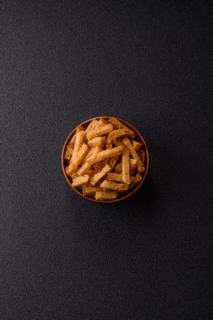 Croutons or crackers made from rye bread with garlic, salt, and spices, a salad ingredient. Croutons...