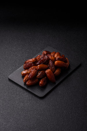 Dried dates on a plate. Dried dates as a food background for your design