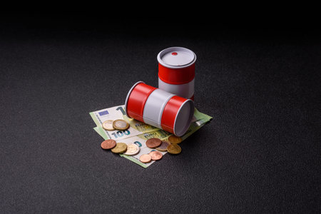 A barrel of oil against a backdrop of euro as a concept for the global oil crisis and rising prices. A barrel of oil and euro as a background for your designの写真素材