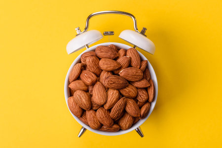 Raw and peeled almonds as a healthy food ingredient. Almonds as a food background for your design
