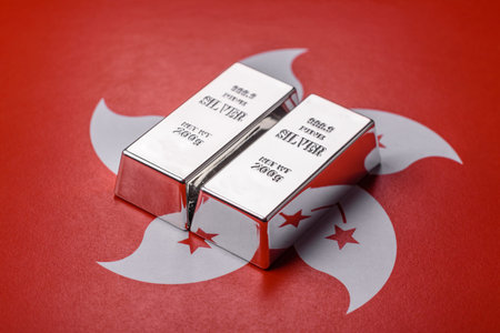 A silver bar, white metal against a backdrop of hong kong flag, as a concept for the sales market. A silver bar as a background for your design