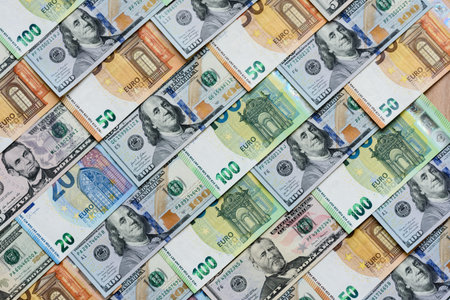 Euro and dollar banknotes, exchange, sales, economic tariffs, and taxes and duties. Euros and dollars as a background for your design