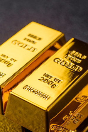 Gold bars or ingots as a metal for bank storage, investments, and financial transactions. Gold bars as a background for your design