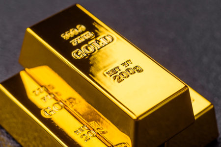 Gold bars or ingots as a metal for bank storage, investments, and financial transactions. Gold bars as a background for your design