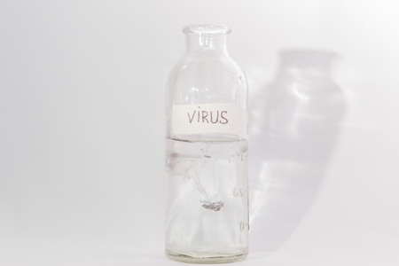 virus in a glass bottle on a white backgroundの写真素材