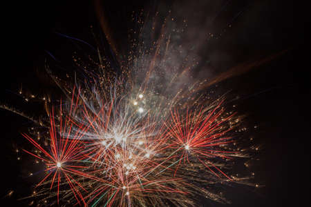 Sparks celebratory salute against a black backdrop of the sky.の写真素材