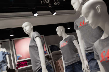 Mannequins in the store, sale of clothes, discounts on the goods
