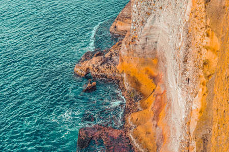 Aerial view of sea waves and rocks in Napoli, Italyの写真素材