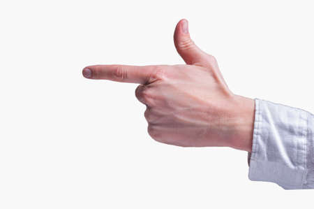 Human hand in a white shirt shows the finger gun sigh on isolated white backgroundの写真素材