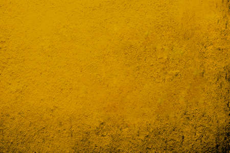 Stucco cement wall, decorative grunge abstract yellow background.  Textured banner stylized wallpaper.の写真素材