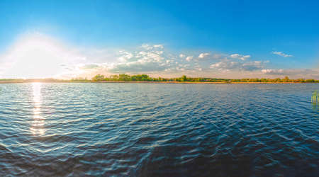 Panoramic view of the Kamenka river in the Zhytomyr region of Ukraine. Beautiful landscape of a large blue pondの写真素材