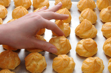 Profiteroles in the oven. eclairの写真素材