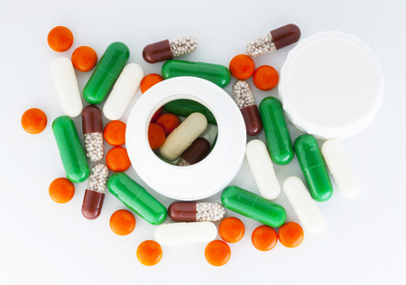 variety pills and capsules in a heap.の写真素材