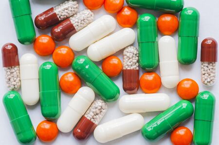 variety pills and capsules in a heap.の写真素材