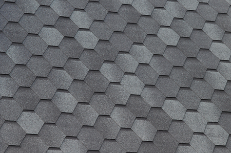 Close up view on Asphalt Roofing Shingles Background. Roof Shingles - Roofing. Bitumen tile roof.の写真素材