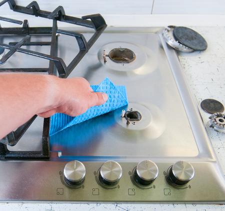 Cleaning a gas stove.の写真素材