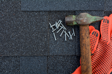 Asphalt Roofing Shingles Background. Roof Shingles - Roofing. Asphalt Roofing Shingles Hammer, Gloves and Nailsの写真素材