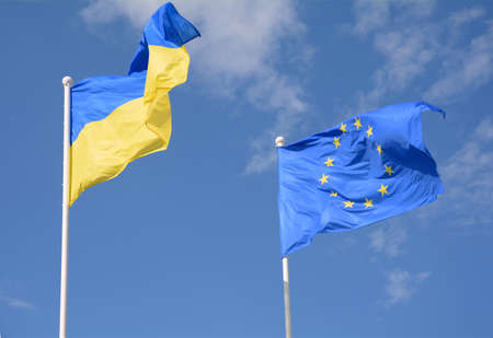 Flags of Ukraine and European Union (EU) fluttering in the wind
