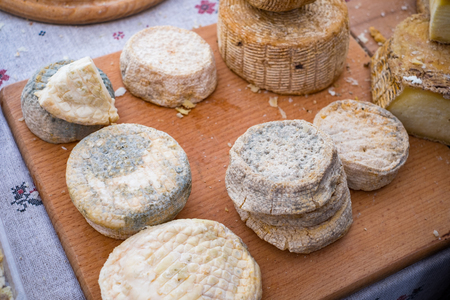 Homemade organic farm cheese at the street food fair.の写真素材