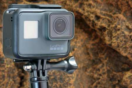 KIEV, UKRAINE - JUNE 05, 2018: Gopro Hero Black action camera against the background of rocks.のeditorial素材