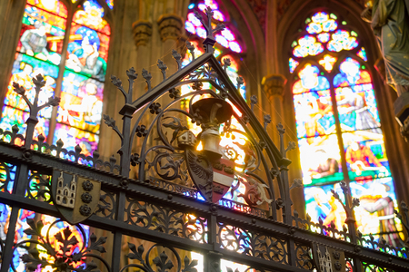 Vienna, Austria - October 09, 2018: Beautiful coat of arms, fence and Stained glass in Votive Church.のeditorial素材