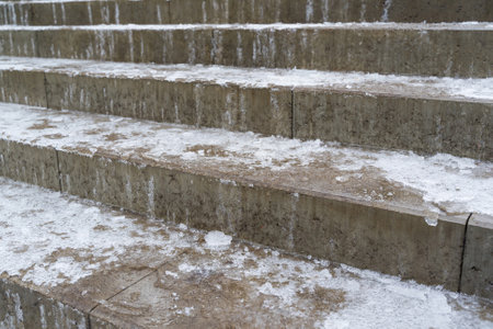 Ice on the stair steps is a hazard to pedestrian traffic.の写真素材