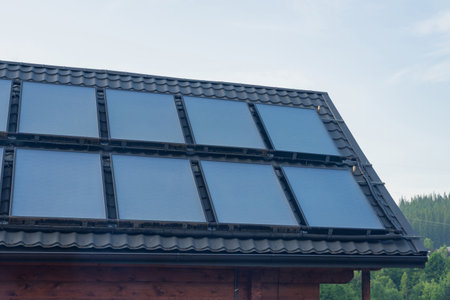 Solar thermal heating system for hot water on grey roof.の写真素材