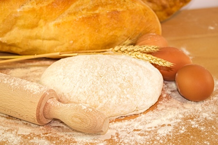 Dough for bread on wooden boardの写真素材
