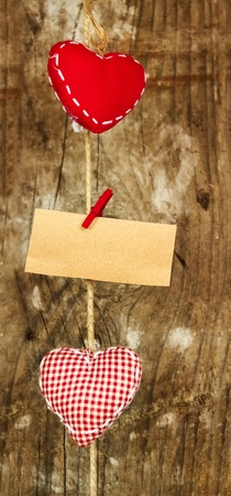 Two fabric hearts over wooden background の写真素材
