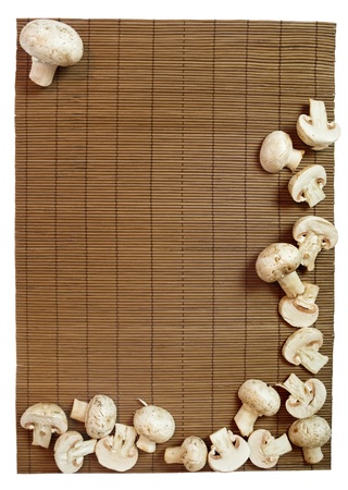 Fresh champignons on wooden background in frame shape の写真素材