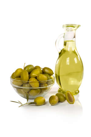 olives and a bottle of olive oil isolated on whiteの写真素材