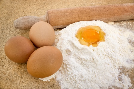 
Basic ingredients for baking, egg and flour on tableの写真素材