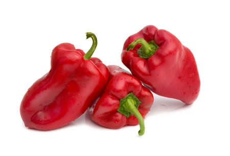 Red peppers over white backgroundの写真素材