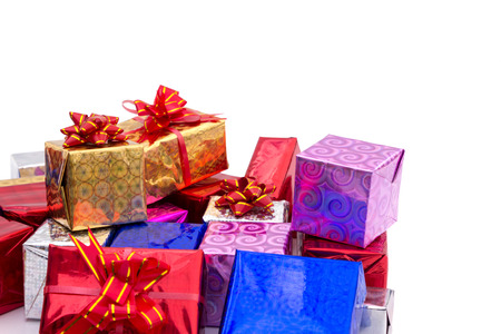 Pile of colorful gifts boxes with red ribbon の写真素材