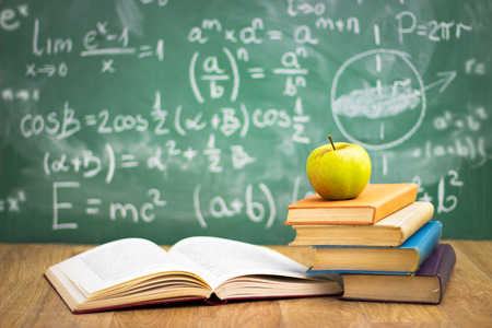 Stack of books in classroom, concept - back to school