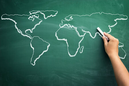 Hand drawing world map on a school blackboardの写真素材